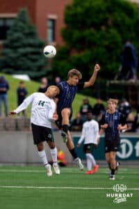 Schuyler midfielder Anthony Gomez (14) attempts a header against Bennington's Max Leight (9) during the NSAA Boys Class B soccer finals on Tuesday, May 20, 2025, in Omaha, Nebraska. Photo by Braden Cochran.