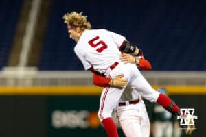 Nebraska Cornhusker Josh Overbeek (4) picks up Nebraska Cornhusker outfielder Robby Bolin (5) celebrating the walk-off win against the Michigan State Spartans during the Big Ten Baseball Tournament on Tuesday, May 20, 2025 in Omaha, Nebraska. Photo by John S. Peterson.