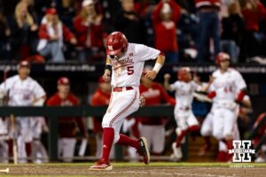 Nebraska Cornhusker Robby Bolin (5) scores the tying run against the Michigan State Spartans in the ninth inning during the Big Ten Baseball Tournament on Tuesday, May 20, 2025 in Omaha, Nebraska. Photo by John S. Peterson.