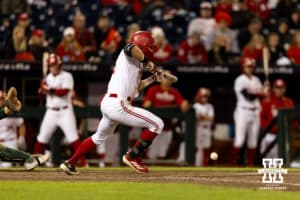 Nebraska Cornhusker Robby Bolin (5) bunts for a single in the bottom of the ninth against the Michigan State Spartans during the Big Ten Baseball Tournament on Tuesday, May 20, 2025 in Omaha, Nebraska. Photo by John S. Peterson.
