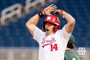 Nebraska Cornhusker utility Case Sanderson (14) celebrates a single during the Big Ten Baseball Tournament on Tuesday, May 20, 2025 in Omaha, Nebraska. Photo by Mac Johnson.