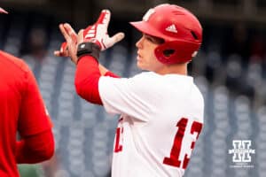 Nebraska Cornhusker utility Will Jesske (13) celebrates a single during the Big Ten Baseball Tournament on Tuesday, May 20, 2025 in Omaha, Nebraska. Photo by Mac Johnson.
