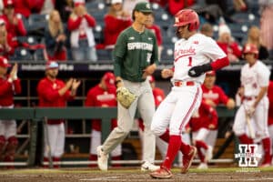 Nebraska Cornhusker outfielder Riley Silva (1) corsses home plate during the Big Ten Baseball Tournament on Tuesday, May 20, 2025 in Omaha, Nebraska. Photo by Mac Johnson.