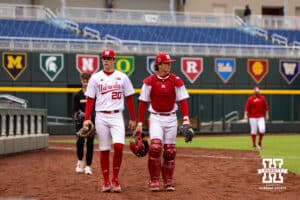 Nebraska Cornhusker starting pitcher Ty Horn (20) and catcher Hogan Helligso (10) make their way to the infield to start the game against the Michigan State Spartans during the Big Ten Baseseball Tournament on Tuesday, May 20, 2025 in Omaha, Nebraska. Photo by John S. Peterson.