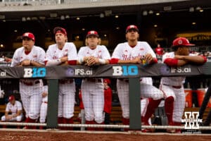 Nebraska Cornhuskers hangout on the rail waiting for the game to start agains the Michigan State Spartans during the Big Ten Baseseball Tournament on Tuesday, May 20, 2025 in Omaha, Nebraska. Photo by John S. Peterson.