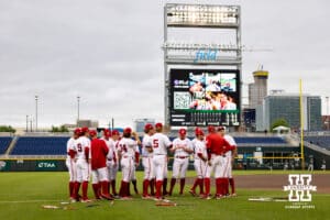 Nebraska Cornhuskers huddle up before taking on the Michigan State Spartans during the Big Ten Baseseball Tournament on Tuesday, May 20, 2025 in Omaha, Nebraska. Photo by John S. Peterson.
