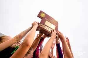 Lincoln Southwest celebtrating with the State Championship trophy after the NSAA Girls Class A soccer finals on Monday, May 19, 2025, in Omaha, Nebraska. Photo by Braden Cochran.