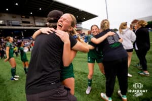 Lincoln Southwest players and coaches celebrate after the NSAA Girls Class A soccer finals on Monday, May 19, 2025, in Omaha, Nebraska. Photo by Braden Cochran.