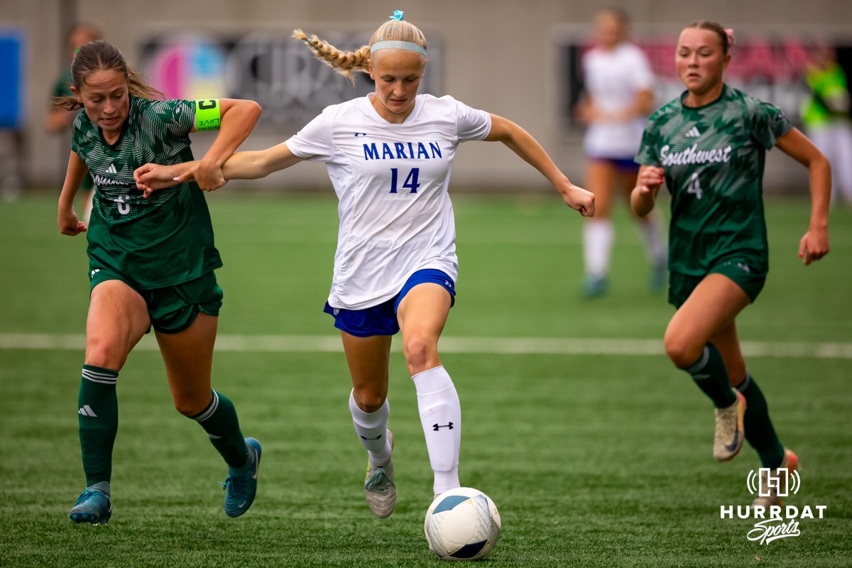 18_BC20250519_SOUTHWEST_v_MARIAN_GSOCFINALS_-07_WM Marian's Paige Miller dribbles through a couple Lincoln Southwest defenders during the NSAA Girls Class A soccer finals on Monday, May 19, 2025, in Omaha, Nebraska. Photo by Braden Cochran.