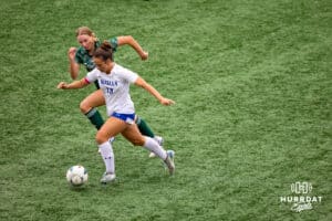 Omaha Marian's Cooper Dally (18) dribbles the ball against Southwest player during the NSAA Girls Class A soccer finals on Monday, May 19, 2025, in Omaha, Nebraska. Photo by Braden Cochran.