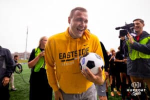 Gretna East head coach Chance Hutchinson gets hit with an ice water shower after the NSAA Girls Class B soccer finals against Pius on Monday, May 19, 2025, in Omaha, Nebraska. Photo by Braden Cochran.