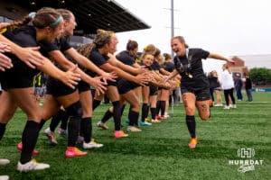 Gretna East's Ella Johns celebrates with her teammates after the NSAA Girls Class B soccer finals on Monday, May 19, 2025, in Omaha, Nebraska. Photo by Braden Cochran.