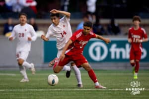 South Sioux City's David Hernandez (14) tries to make a move upfield against Damien Fierro (3) during the NSAA Boys Class A soccer semi-finals on Friday, May 16, 2025, in Omaha, Nebraska. Photo by Braden Cochran.