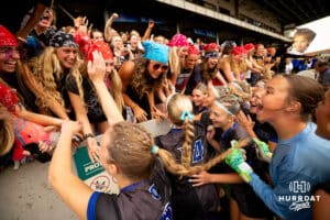 Omaha Marian celebrates with their student section after the NSAA Girls Class A soccer semi-finals on Friday, May 16, 2025, in Omaha, Nebraska. Photo by Braden Cochran.