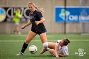 Marian Forward paide Miller (13) breaks around a fallen Bellevue West defender during the NSAA Girls Class A soccer semi-finals on Friday, May 16, 2025, in Omaha, Nebraska. Photo by Braden Cochran.