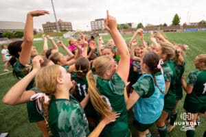 Lincoln Southwest celebrates together after the win over Elkhorn South during the NSAA Girls Class A soccer semi-finals on Friday, May 16, 2025, in Omaha, Nebraska. Photo by Braden Cochran.