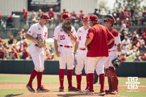 Nebraska Cornhusker pitching coach Rob Childress talks Ty Horn at the mound during a college baseball game Saturday, May 10, 2025, in Lincoln, Nebraska. Photo by Jansen Coburn.