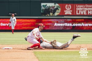 Nebraska Cornhusker utility Cayden Brumbaugh (0) makes a tag against Michigan during a college baseball game Saturday, May 10, 2025, in Lincoln, Nebraska. Photo by Jansen Coburn.
