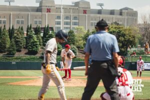 Nebraska Cornhusker pitcher Ty Horn (20) looks to first against Michigan during a college baseball game Saturday, May 10, 2025, in Lincoln, Nebraska. Photo by Jansen Coburn.