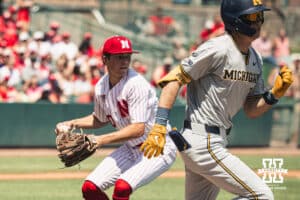Nebraska Cornhusker pitcher Ty Horn (20) throws to first against Michigan during a college baseball game Saturday, May 10, 2025, in Lincoln, Nebraska. Photo by Jansen Coburn.