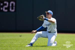 Creighton Bluejay outfielder Teddy Deters (4) makes a catch sliding on his knee against the Xavier Musketeers in the fifth inning during a college baseball game on Sunday, May 11, 2025 in Omaha, Nebraska. Photo by John S. Peterson.