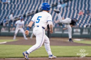 Creighton Bluejays Nate McHugh looks to score during a baseball game against Xavier on May 9th, 2025 in Omaha Nebraska. Photo by Brandon Tiedemann.
