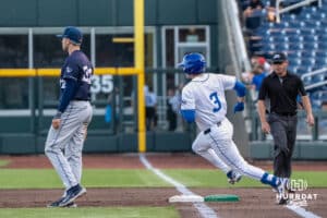 Creighton Bluejays Matt Scherrman rounds first base during a baseball game against Xavier on May 9th, 2025 in Omaha Nebraska. Photo by Brandon Tiedemann.