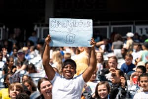 Creighton Bluejays young fan holds up a Creighton sign during a baseball game Tuesday , April 29th, 2025 in Omaha, Nebraska. Photo by Brandon Tiedemann.