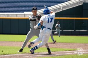 Omaha Mavericks Isaac Cychosz tags Will MacLean during a baseball game Tuesday , April 29th, 2025 in Omaha, Nebraska. Photo by Brandon Tiedemann.