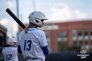 Creighton Bluejay outfielder Ella Dalton (13) waits to hit during a softball game against Seton Hall Friday, May 2nd 2025 in Omaha, Nebraska. Photo by Brandon Tiedemann.