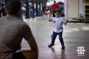 Creighton Bluejays head coach Ed Servais' grandson throwing a pitch to his father after the game against the Nebraska Cornhuskers during a college baseball game on Tuesday, May 6, 2025 in Lincoln, Nebraska. Photo by John S. Peterson.