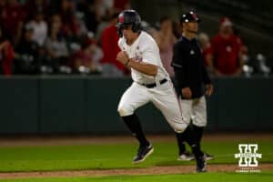 Nebraska Cornhusker utility Case Sanderson (14) scores in the ninth against the Creighton Bluejays during a college baseball game on Tuesday, May 6, 2025 in Lincoln, Nebraska. Photo by John S. Peterson.