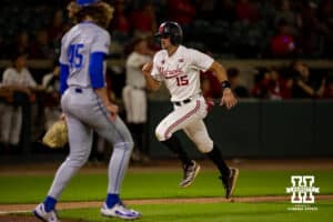 Nebraska Cornhusker infielder Dylan Carey (15) scores in the ninth inning against the Creighton Bluejays during a college baseball game on Tuesday, May 6, 2025 in Lincoln, Nebraska. Photo by John S. Peterson.