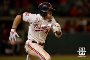 Nebraska Cornhusker infielder Josh Overbeek (4) singles in the ninth inning against the Creighton Bluejays during a college baseball game on Tuesday, May 6, 2025 in Lincoln, Nebraska. Photo by John S. Peterson.