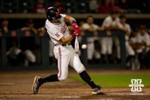Nebraska Cornhusker infielder Dylan Carey (15) singles in the ninth inning against the Creighton Bluejays during a college baseball game on Tuesday, May 6, 2025 in Lincoln, Nebraska. Photo by John S. Peterson.