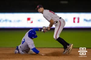 Creighton Bluejay utility Matt Scherrman (3) slides to second interfering the Nebraska Cornhusker infielder Dylan Carey (15) throwing to first in the ninth inning during a college baseball game on Tuesday, May 6, 2025 in Lincoln, Nebraska. Photo by John S. Peterson.