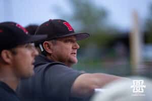 Nebraska Cornhuskers head coach Will Bolt reachs to the umpire's call on a pitch during a college baseball game against the Creighton Bluejays on Tuesday, May 6, 2025 in Lincoln, Nebraska. Photo by John S. Peterson.