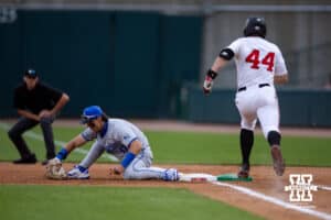 Creighton Bluejay first baseman Will MacLean (17) makes the catch at first for the out against Nebraska Cornhusker outfielder Gabe Swansen (44) in the sixth inning during a college baseball game on Tuesday, May 6, 2025 in Lincoln, Nebraska. Photo by John S. Peterson.