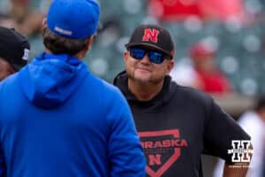 Nebraska Cornhuskers head coach Will Bolt meeting with Creighton Bluejays head coach Ed Servais during a college baseball game on Tuesday, May 6, 2025 in Lincoln, Nebraska. Photo by John S. Peterson.