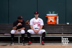 Nebraska Cornhusker pitcher Will Walsh (30) sitting in the bullpen with pitching coach Rob Childress before taking on Creighton Bluejays during a college baseball game on Tuesday, May 6, 2025 in Lincoln, Nebraska. Photo by John S. Peterson.