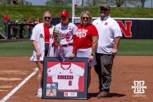 Nebraska Cornhusker Abbie Squier (8) poses with her family for a photo for the Senior Day celebration after the win over the Maryland Terrapins during a college softball game on Sunday, May 4, 2025 in Lincoln, Nebraska. Photo by John S. Peterson.