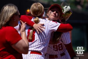 Nebraska Cornhusker Abbie Squier (8) receives a hug from Jordyn Bahl for the Senior Day celebrations after the win over the Maryland Terrapins during a college softball game on Sunday, May 4, 2025 in Lincoln, Nebraska. Photo by John S. Peterson.