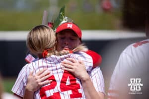 Nebraska Cornhusker Ava Bredwell (24) receives a hug from Kacie Hoffmann for the Senior Day celebrations after the win over the Maryland Terrapins during a college softball game on Sunday, May 4, 2025 in Lincoln, Nebraska. Photo by John S. Peterson.