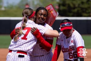 Nebraska Cornhusker Haidyn Warner (77) receives hugs from Macie Vickers and Katelyn Caneda for the Senior Day celebrations after the win over the Maryland Terrapins during a college softball game on Sunday, May 4, 2025 in Lincoln, Nebraska. Photo by John S. Peterson.