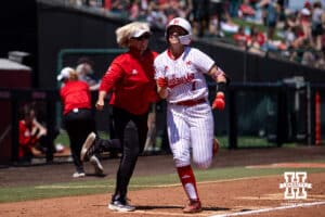 Nebraska Cornhusker Ava Kuszak (7) runs home after hitting a home run against the Maryland Terrapins in the sixth inning for the walk-off win during a college softball game on Sunday, May 4, 2025 in Lincoln, Nebraska. Photo by John S. Peterson.