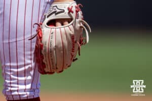 Nebraska Cornhusker Kylee Magee (31) has some inspiration on written her glove while pitching against Maryland Terrapins in the sixth inning during a college softball game on Sunday, May 4, 2025 in Lincoln, Nebraska. Photo by John S. Peterson.