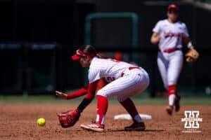 Nebraska Cornhusker Lauren Camenzind (2) scoops up the ball against the Maryland Terrapins in the fourth inning during a college softball game on Sunday, May 4, 2025 in Lincoln, Nebraska. Photo by John S. Peterson.