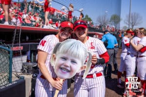 Nebraska Cornhusker Ava Kuszak (left) and senior Abbie Squier (right) pose with a picture of Abbie for senior day during a college softball game on Sunday, May 4, 2025 in Lincoln, Nebraska. Photo by John S. Peterson.