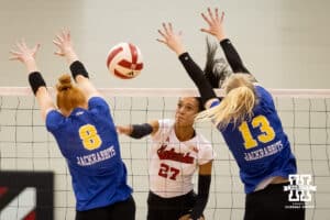 Nebraska Cornhusker Harper Murray (27) spikes the ball between South Dakota State Jackrabbit Madison Burr (8) and Annalee Ventling-Brown (12) during the spring match on Saturday, May 3, 2025 in Ord, Nebraska. Photo by John S. Peterson