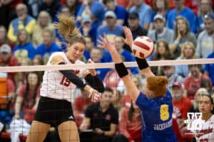 Nebraska Cornhusker Andi Jackson (15) spikes the ball past South Dakota State Jackrabbit Madison Burr (8) during the spring match on Saturday, May 3, 2025 in Ord, Nebraska. Photo by John S. Peterson